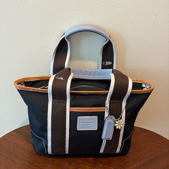 Coach Hampton mini tote navy canvas/ tan & Lt blue leather trim
Vinyl interior - Picture 1 of 17